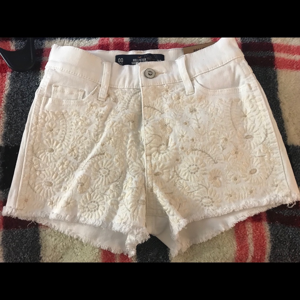 Hollister high wasted white jean shorts.